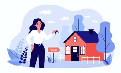 Woman holding keys from house for sale and smiling isolated flat vector illustration. Cartoon realty agent standing near building. Real estate and mortgage concept